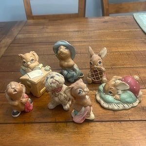 A set of seven Pendelfin figurines burmley England. Stone crafted and registered